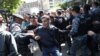 Сотрудники полиции задерживают активистов во время акций протеста сторонников оппозиции в центре Еревана. 18 мая 2022г.