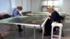 Maglaj, Bosnia and Herzegovina -- Conservationists working on restoring a oil painting