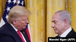 Američki predsednik Donald Tramp i izraelski premijer Benjamin Netnjahu na predstavljanju mirovnog plana SAD u Vašingtonu, 28. januara 2020.