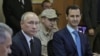 Президенттер Путин жана Асад Сириянын Хмеймим аскер базасында жолукканда. 11-декабрь, 2017-жыл. 