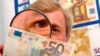 Germany -- Klaus-Dieter Ehling, an expert for counterfeit money at Mecklenburg-Vorpommern's State Bureau of Criminal Investigation, 11Aug2004