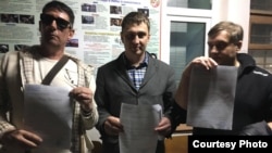 Олег Кочеров, Ілья Большедворов та Сергій Акімов, затримані в Сімферополі, 18 березня 2019 року