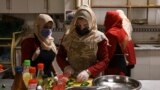 Survivors of domestic violence are seen cooking at a restaurant in Kabul established by Mary Akrami, founder of a shelter and a restaurant where women lived and worked. (file photo)