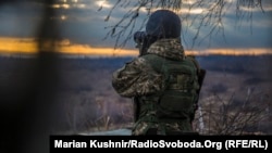 Ukraine -- Soldier looks at the slagheap controled by prorussian rebels from position of the Ukrainian military on the slagheap near the mine of Zolote-4, 13Dec2017