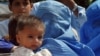 FILE: Families fleeing fighting in Mohmand Agency in 2008.