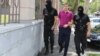 Armenia - Masked policemen escort Tigran Khachatrian, a son of Syunik Governor Surik Khachatrian, to a Yerevan court, 27Jul2015