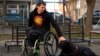 Aleksandar Veleski, person with cerebral palsy and his dog Ben