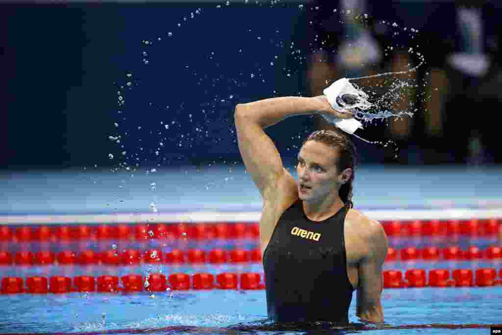 Katinka Hosszu celebrates shattering the world record in the women's 400-meter individual medley. Her winning time of 4 minutes, 26.36 seconds knocked two seconds off the previous record. 