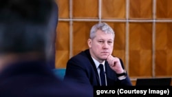 Cătălin Predoiu conduce ministerul care ar dori transformarea uneia dintre zonele-simbol ale Revoluției din Decembrie 1989 în zonă militarizată cu acces redus.