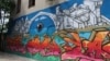 Bosnia and Herzegovina -- A mural in Bosnian city of Mostar (art, wall, walls, society, idea, ideas, creativity, building, buildings, beautiful, urban, young people, artists), June 16, 2021.