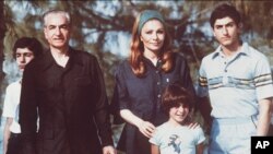 The shah of Iran (left) with his wife and sons Crown Prince Reza on right) and daughter shown during their stay in the Bahamas in April 1979.