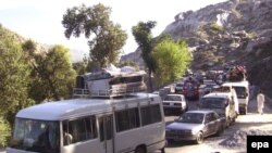 People fleeing Mingora earlier this month