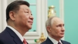 Russian President Vladimir Putin and Chinese President Xi Jinping attend a meeting at the Kremlin in Moscow in May.