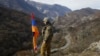 ARMENIA -- An Armenian soldier stands guard atop a hill near Charektar village, November 25, 2020