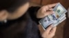 Нацбанк Кыргызстана провел крупнейшую за 10 месяцев интервенцию для сдерживания роста доллара