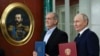 Russian President Vladimir Putin (right) and Iranian President Masud Pezeshkian attend a signing ceremony earlier this year for a partnership treaty after talks at the Kremlin in Moscow.