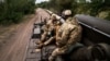 Украинские артиллеристы на самоходной 203-мм пушке 2С7 «Пион» на южном фронте Украины близ Херсона, 14 сентября 2022 года
