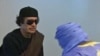 Муамар Каддафи