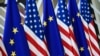 BELGIUM – This photo taken on May 15, 2017 in Brussels shows US and European Union flags at the EU headquarters. - US president Donald Trump will visit Brussels on May 25