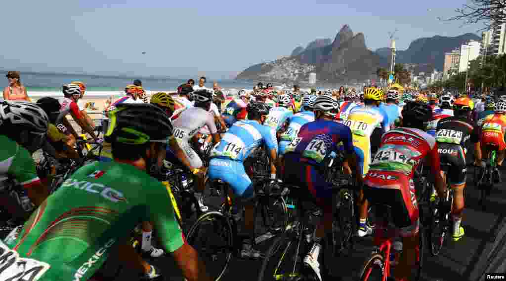 Cyclists start the men's road race race from Copacabana Beach.