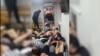 В социальных сетях появилось видео, на котором запечатлено, как мигрантов из Кыргызстана заставляют ползать по полу и лежать друг на друге во время полицейского рейда в Москве