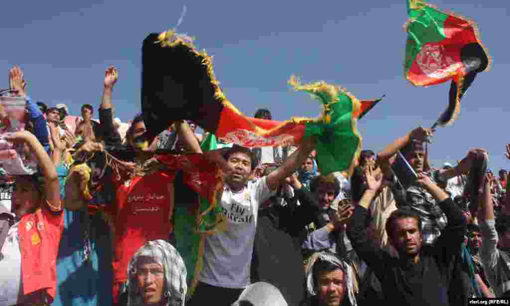Afghan fans celebrate their team's first goal, scored by Sanjar Ahmadi.